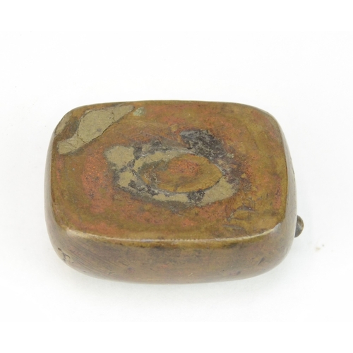 7063 - Three Japanese metal items to include a solid metal aubergine netsuke signed Tsunemitsu  together wi... 