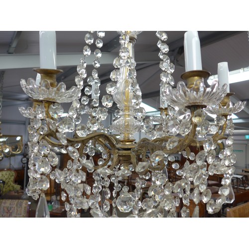 2011 - A French gilt brass and glass chandelier