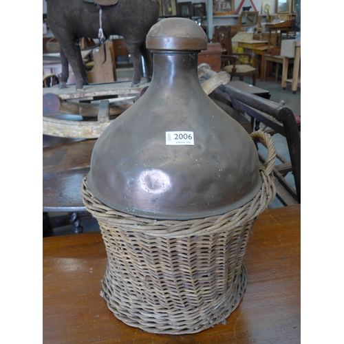 2006 - A copper vessel in wicker basket with cork top