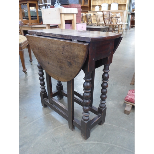 2009 - A small 17th Century style oak gateleg table on bobbin reel legs