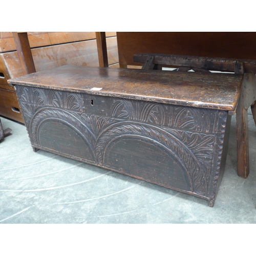 2020 - A 17th Century carved oak six plank coffer, legs reduced