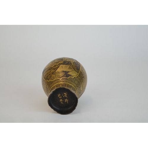 7004 - A miniature Japanese shakudo and gold metal vase, signed

 7cm high x 4.5cm at widest point

 Proven... 