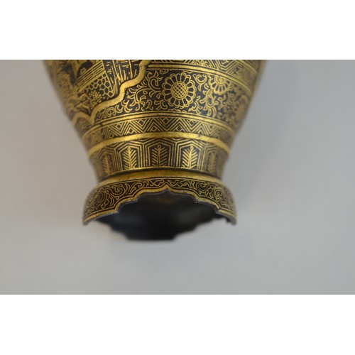 7004 - A miniature Japanese shakudo and gold metal vase, signed

 7cm high x 4.5cm at widest point

 Proven... 