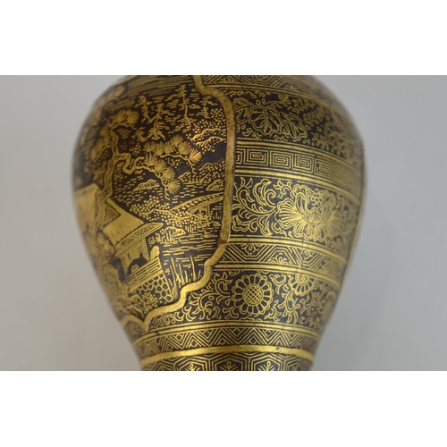7004 - A miniature Japanese shakudo and gold metal vase, signed

 7cm high x 4.5cm at widest point

 Proven... 