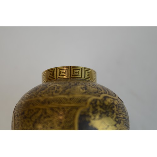7004 - A miniature Japanese shakudo and gold metal vase, signed

 7cm high x 4.5cm at widest point

 Proven... 