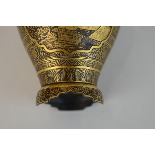 7004 - A miniature Japanese shakudo and gold metal vase, signed

 7cm high x 4.5cm at widest point

 Proven... 