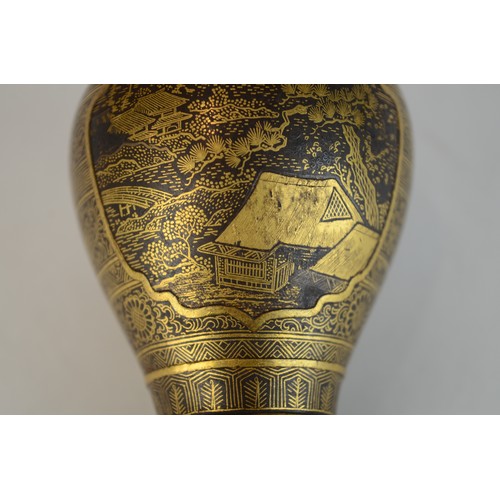 7004 - A miniature Japanese shakudo and gold metal vase, signed

 7cm high x 4.5cm at widest point

 Proven... 