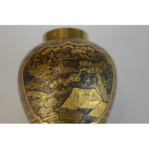 7004 - A miniature Japanese shakudo and gold metal vase, signed

 7cm high x 4.5cm at widest point

 Proven... 