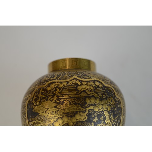 7004 - A miniature Japanese shakudo and gold metal vase, signed

 7cm high x 4.5cm at widest point

 Proven... 