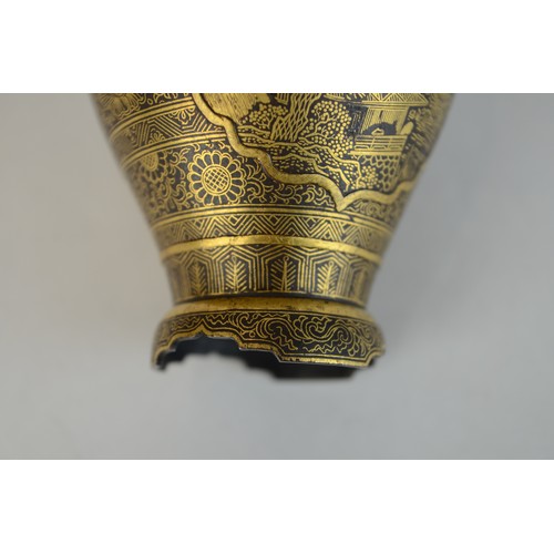 7004 - A miniature Japanese shakudo and gold metal vase, signed

 7cm high x 4.5cm at widest point

 Proven... 