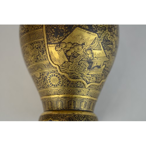7004 - A miniature Japanese shakudo and gold metal vase, signed

 7cm high x 4.5cm at widest point

 Proven... 