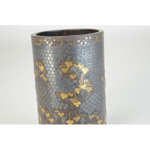 7005 - A Japanese bronze and mixed metal cylindrical vase decorated with fruiting grape vines in gold and s... 