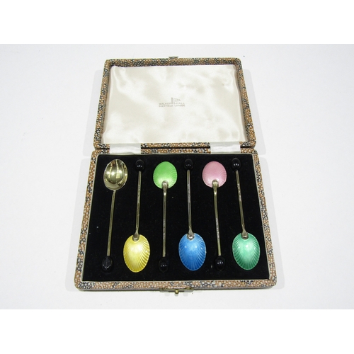 A set of six 1950's Walker & Hall silver and enamel coffee spoons, cased