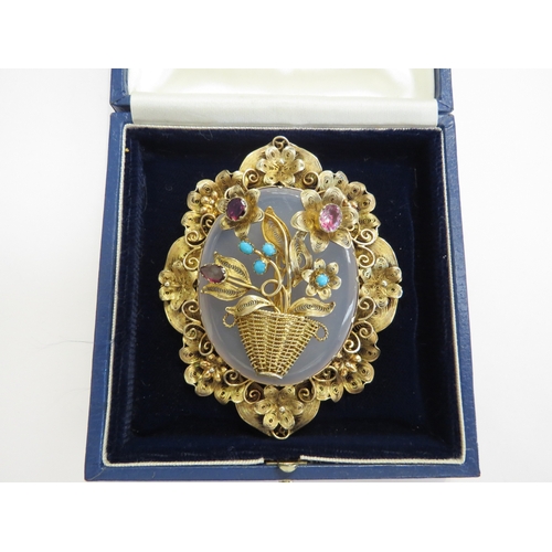 A large gilt filigree brooch, ornate floral frame with basket of ...