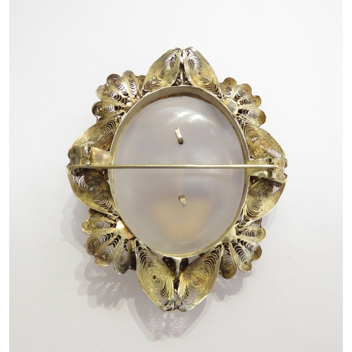 A large gilt filigree brooch, ornate floral frame with basket of ...