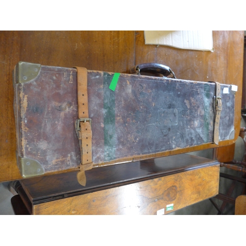 A Victorian leather shotgun case of rectangular form. With cleaning rod ...
