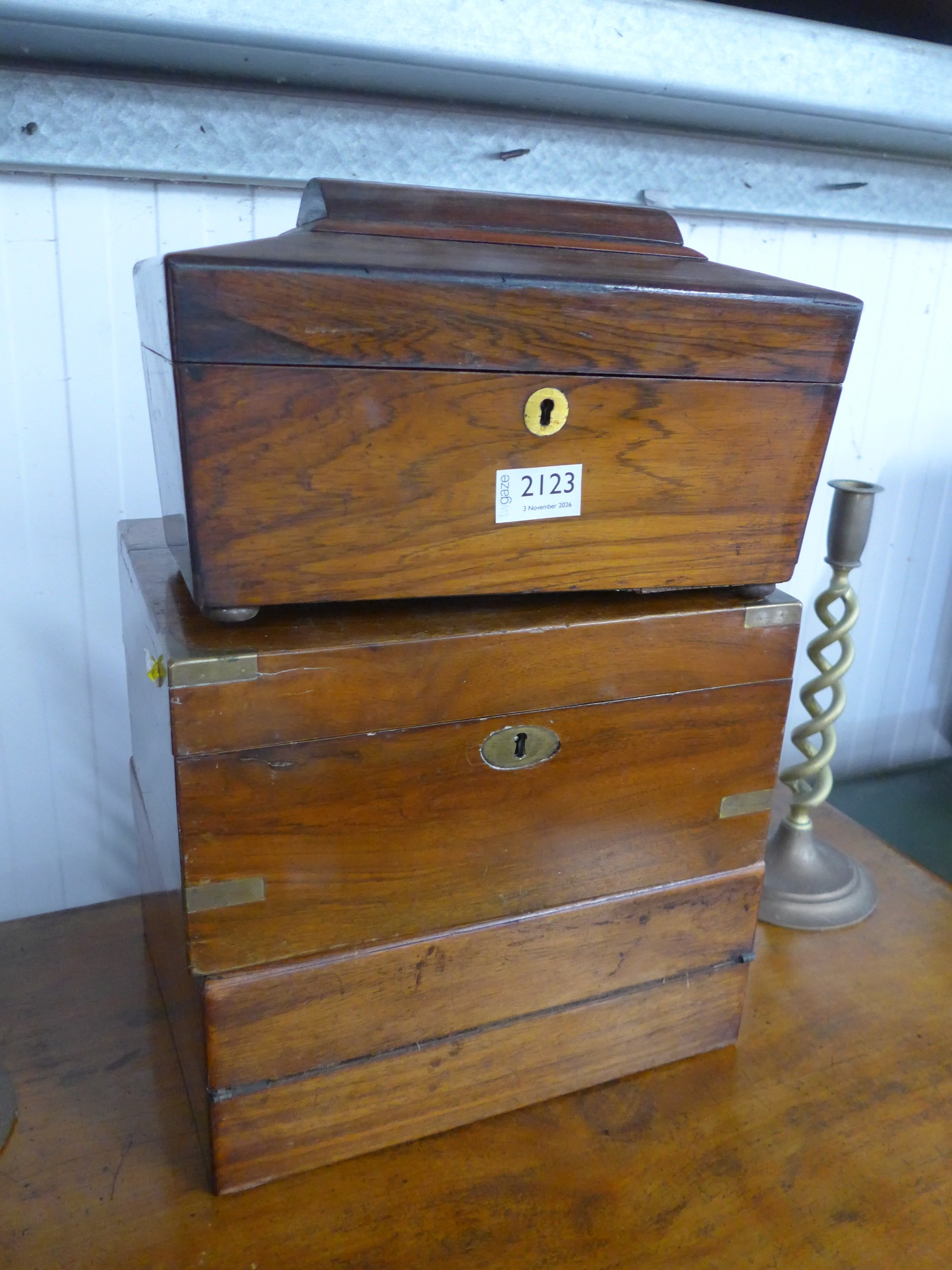 A Regency rosewood tea caddy and two walnut writing boxes