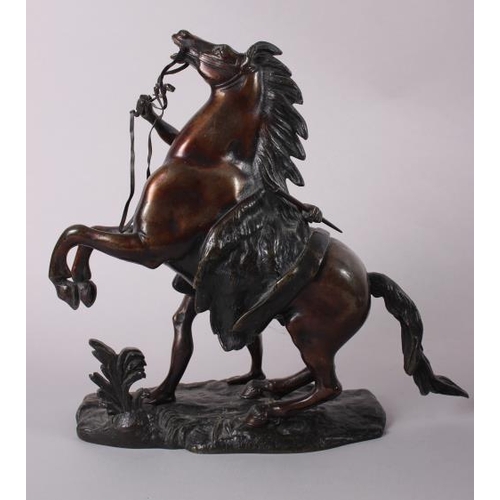 105 - A pair of bronze Marley horses, 10 1/2