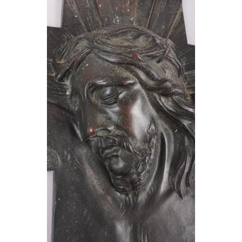 135 - An Art Deco bronze relief cross cast bust of Christ, 9 1/4