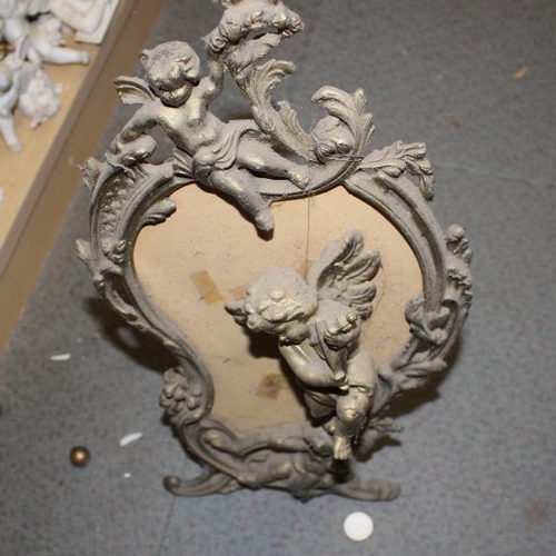 171 - Two carved wooden cherubs, another wooden cherub and three others