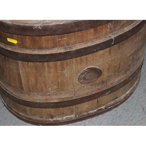 178 - A coopered oak and metal mounted washing barrel, 18