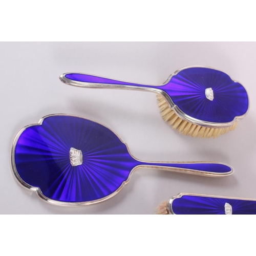 328 - A 1960s silver and blue enamel four-piece dressing table set, decorated naval coronets