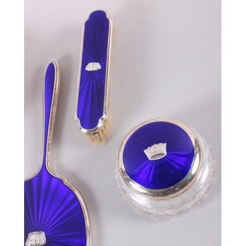 328 - A 1960s silver and blue enamel four-piece dressing table set, decorated naval coronets