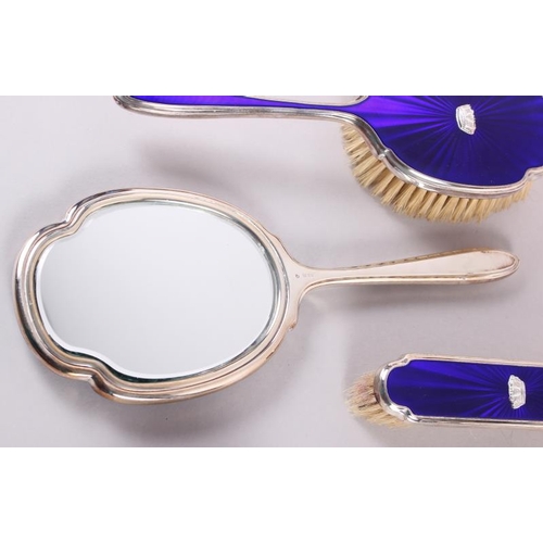 328 - A 1960s silver and blue enamel four-piece dressing table set, decorated naval coronets