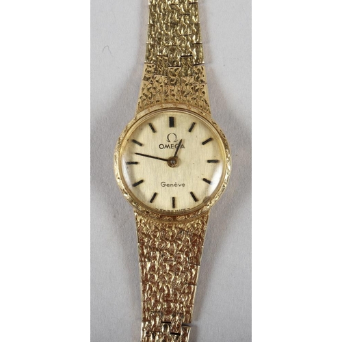 383 - A lady's Omega 18ct textured gold wristwatch and bracelet, 26.2g gross, in case (no winder)