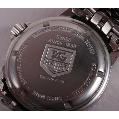 385 - A gentleman's Tag Heuer Professional stainless steel bracelet watch with black dial, baton numerals ... 