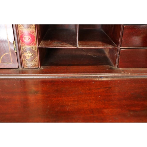 498 - A Georgian mahogany fall front bureau with interior fitted pigeonholes and central cupboard over fou... 