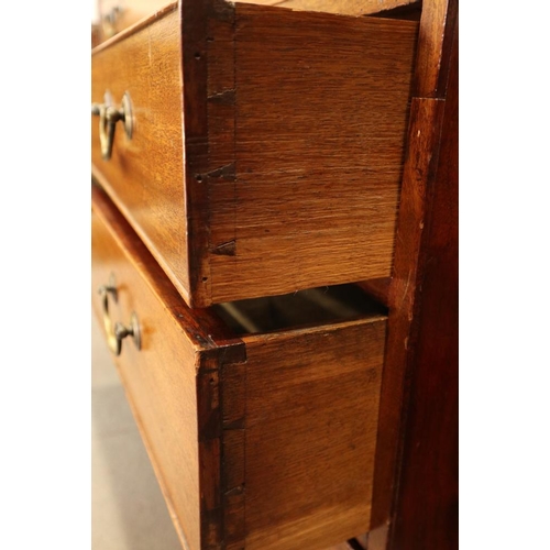 498 - A Georgian mahogany fall front bureau with interior fitted pigeonholes and central cupboard over fou... 