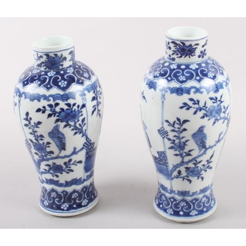 53 - A pair of 19th century Chinese blue and white vases, decorated panels with figures, birds and flora ... 