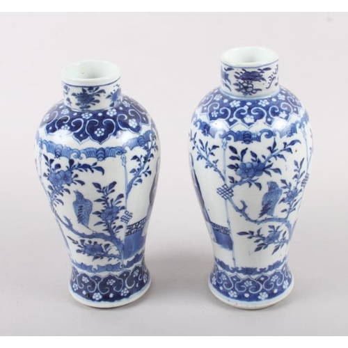 53 - A pair of 19th century Chinese blue and white vases, decorated panels with figures, birds and flora ... 