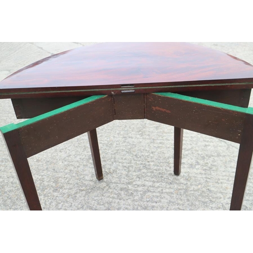 567 - A 19th century semicircular mahogany fold-over top card table, on square taper supports, 36