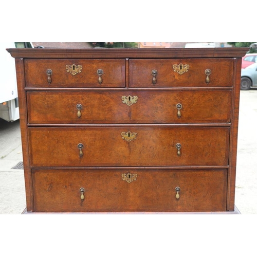 569 - An early 18th century burr walnut chest on stand, the upper section with two short and three long gr... 