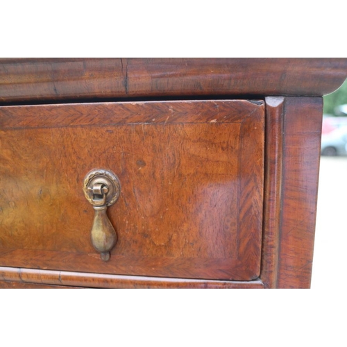 569 - An early 18th century burr walnut chest on stand, the upper section with two short and three long gr... 