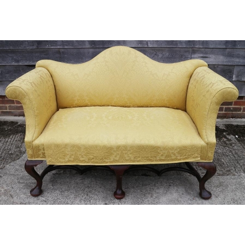 570 - A two seat settee of mid 18th century design, upholstered in an old gold brocade, on cabriole and st... 