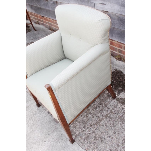 611 - An Edwardian walnut framed armchair, upholstered in a green geometric fabric