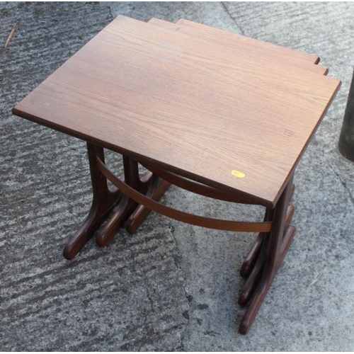 616 - A nest of three teak tables, 22