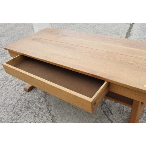 658 - An oak two-tier plank top coffee table, fitted frieze drawer, 22