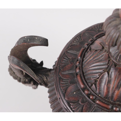 150 - A carved softwood urn and cover with acanthus decoration and goat's head handles, 12