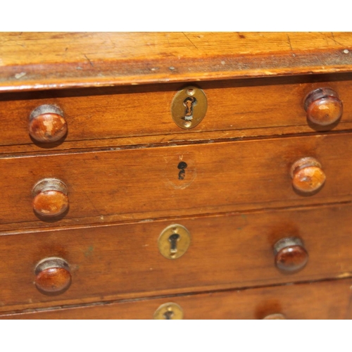 153 - A walnut miniature chest of four long graduated drawers with brass mounted locks (one missing), on b... 