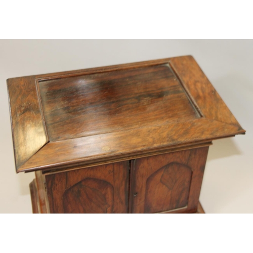 155 - A collectors mid 19th century rosewood cabinet of eight small drawers and two long drawers enclosed ... 