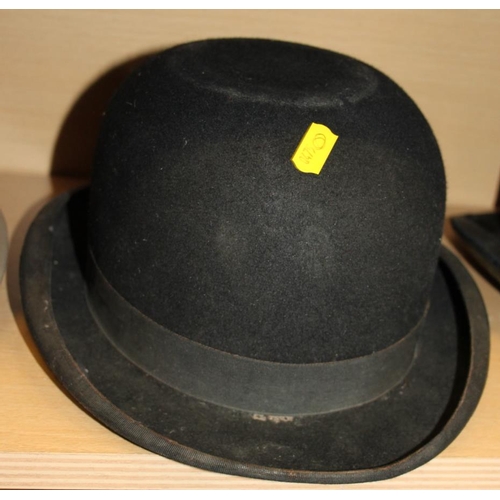 207 - A Lock & Co grey top hat, a black top hat and a Herbert Johnson black bowler hat