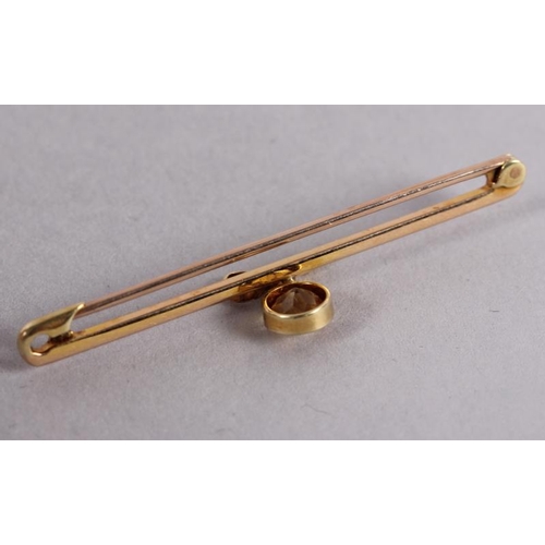 378 - A yellow metal bar brooch set citrine?, 2.4g (one stone missing)