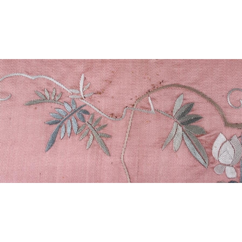 439 - A pair of embroidered panels with floral designs on a pink ground, a needlepoint panel of a woman, a... 