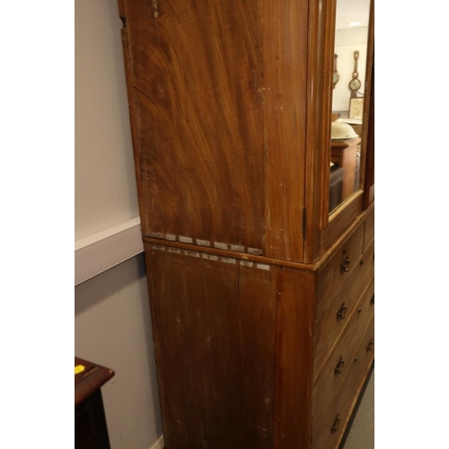 523 - A late 19th century walnut linen press, the upper section fitted trays and enclosed mirror doors ove... 