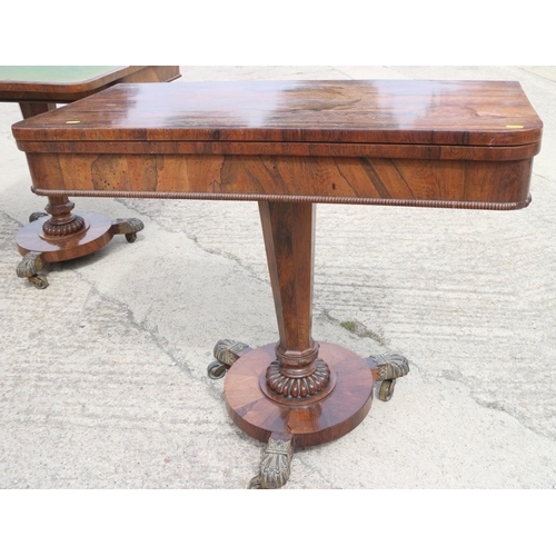 561 - A pair of Regency rosewood fold-over top card tables, on faceted inverse taper columns and circular ... 