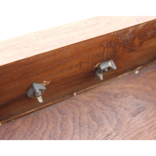 643 - An Oriental hardwood chest of nine drawers with heavy brass handles, on bracket feet, 71